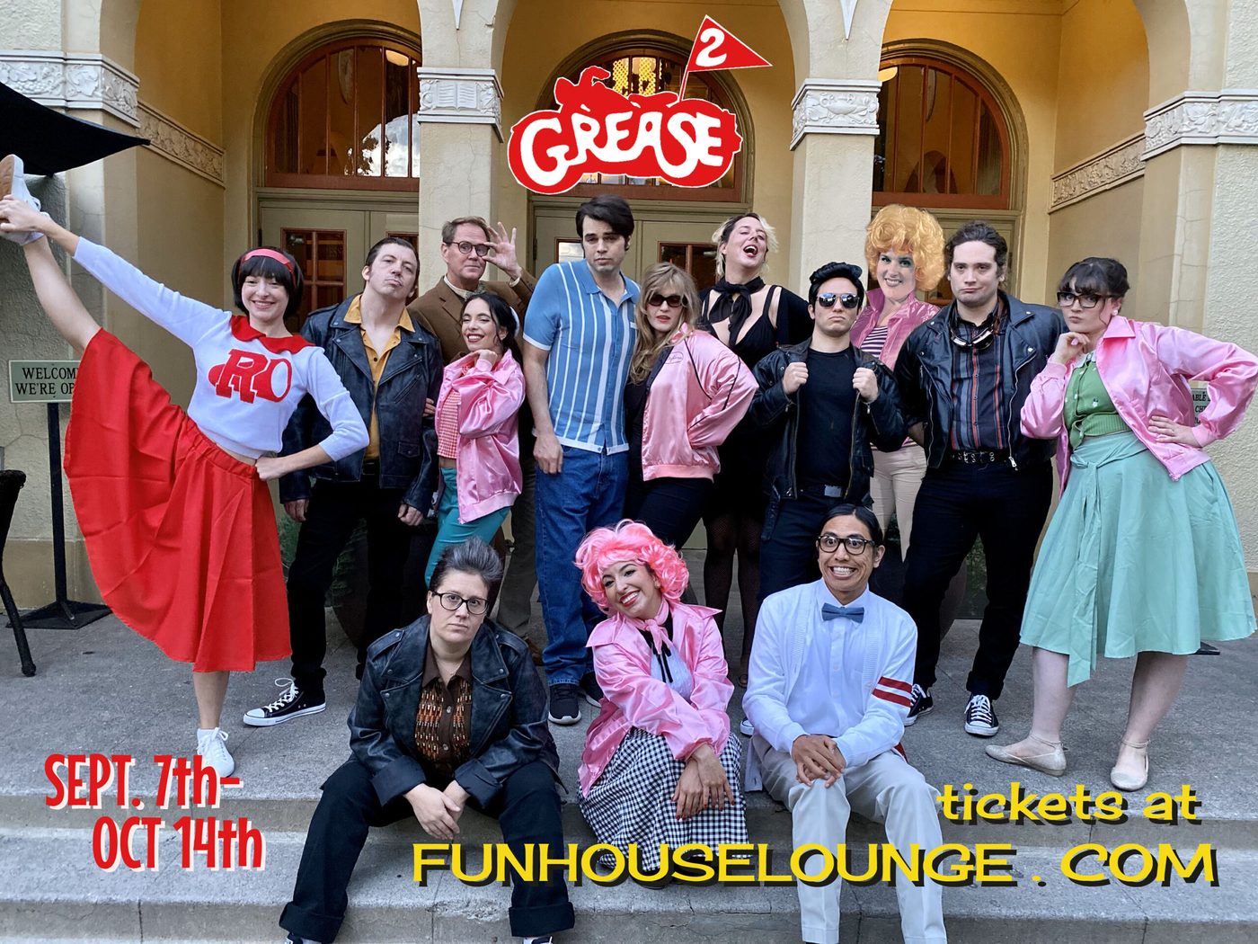 The Funhouse Lounge cast of Grease 2 posed on steps in pink jackets, varsity sweaters and poodle skirts